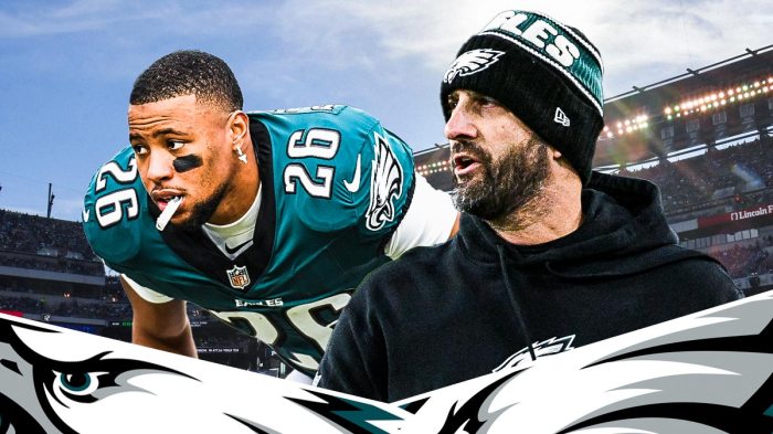 Nick Sirianni next to Saquon Barkley in front of the Eagles stadium