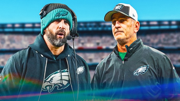 Nick Sirianni next to Frank Reich wearing their Eagles gear in front of the Eagles stadium.