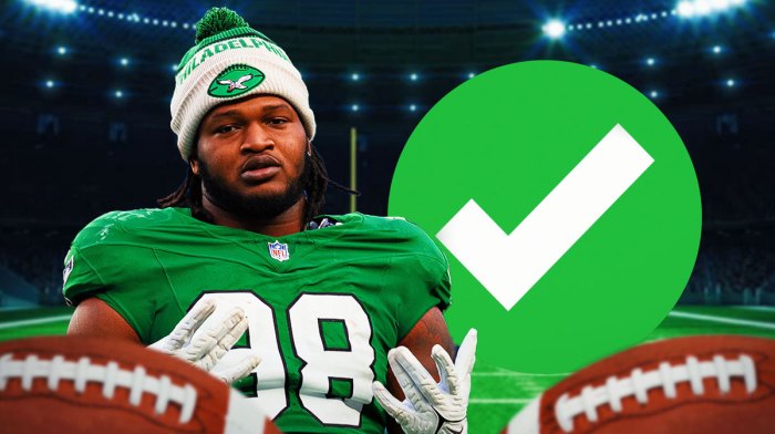 Jalen Carter next to green checkmark with fans background.
