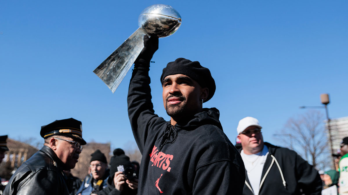 Philadelphia Eagles quarterback Jalen Hurts (1) raises the Lombardi Trophy during the Super Bowl LIX championship parade and rally. 