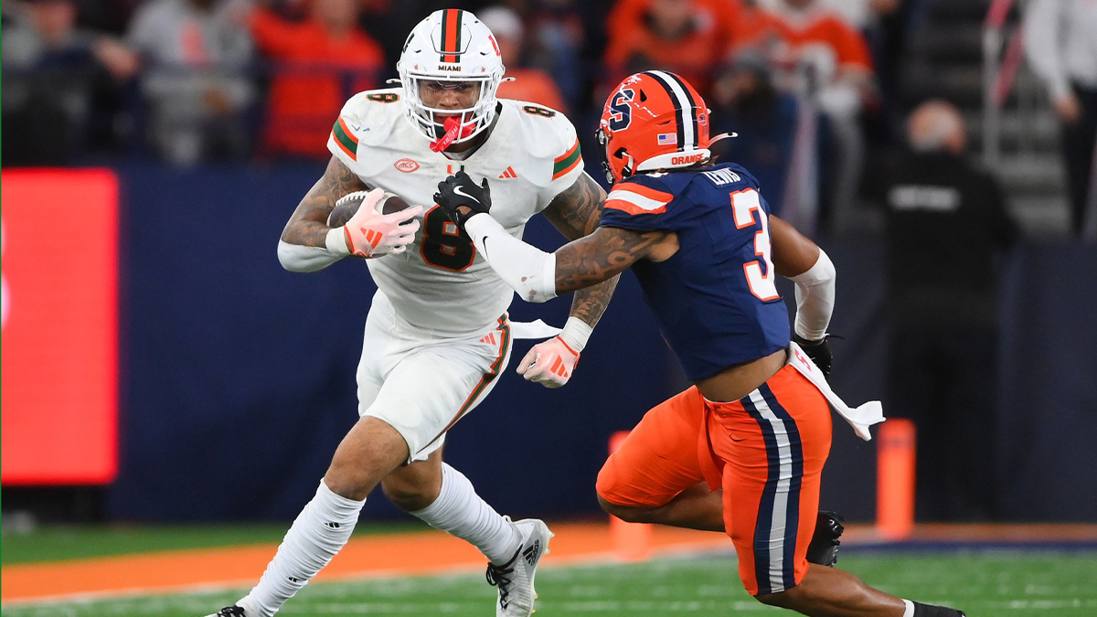 Miami Hurricanes tight end Elijah Arroyo (8) runs with the ball after a catch against Syracuse Orange defensive back Clarence Lewis (3) during the second half at the JMA Wireless Dome