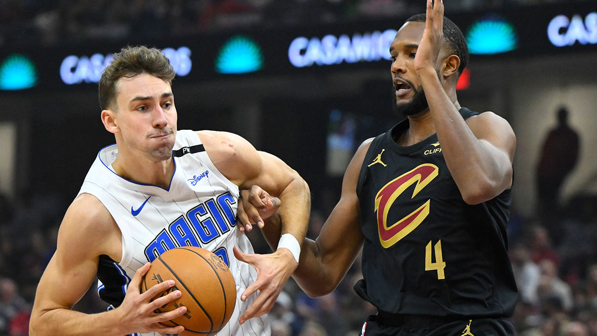 Cleveland Cavaliers forward Evan Mobley (4) defends Orlando Magic forward Franz Wagner (22) in the first quarter at Rocket Mortgage FieldHouse. 