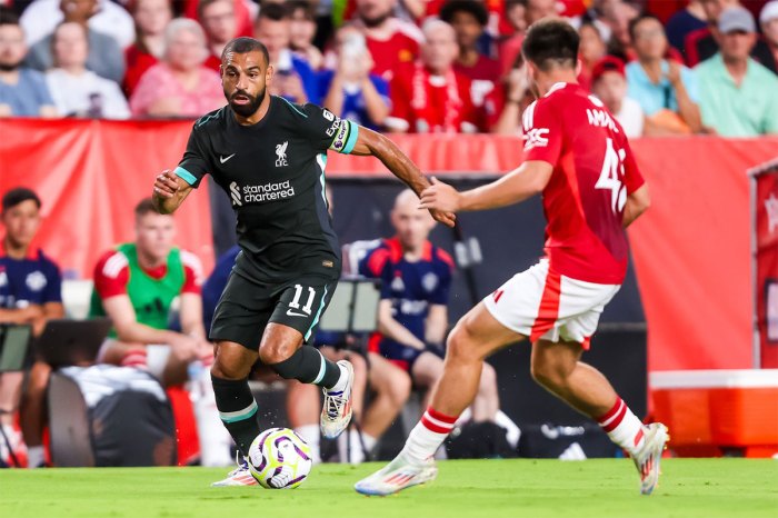 Liverpool forward Mohamed Salah (11) drives past Manchester United Harry Amass (41) at Williams-Brice Stadium.