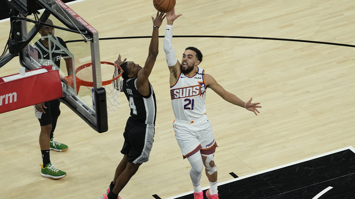 Phoenix Suns Guard Tius Jones (21) shoots via San Antonio Spurs Guard De'Aron Fok (4) during the second half in Moodi Center.