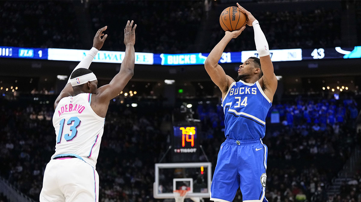 Milwaukee Bucks forward Giannis Antetokounmpo (34) shoots against Milwaukee Bucks guard Ryan Rollins (13) during the second quarter at Fiserv Forum.