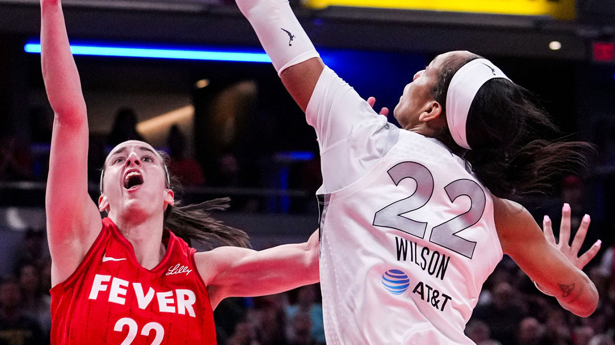 Las Vegas Aces center A'ja Wilson (22) blocks Indiana Fever guard Caitlin Clark (22) on Wednesday, Sept. 11, 2024, during a game between the Indiana Fever and the Las Vegas Aces at Gainbridge Fieldhouse in Indianapolis. The Aces defeated the Fever, 86-75.