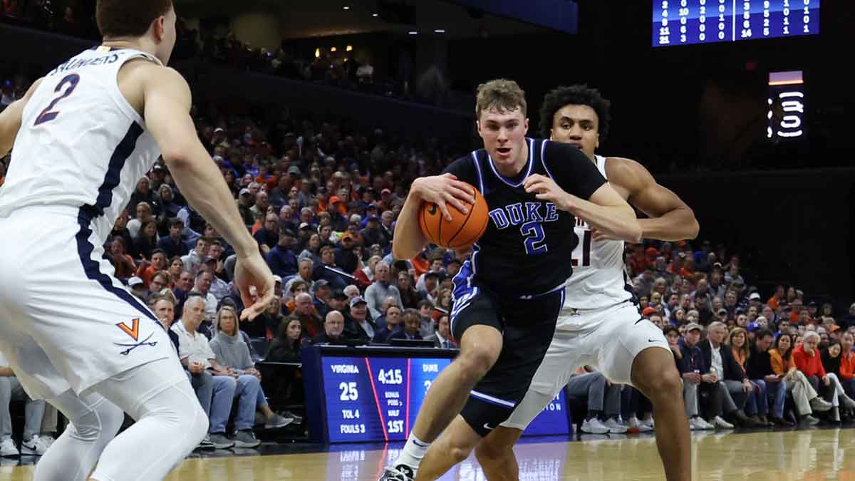 Duke Blue Devils guard Cooper Flagg (2) drives to the basket past Virginia Cavaliers forward Anthony Robinson (21) in the first half at John Paul Jones Arena.