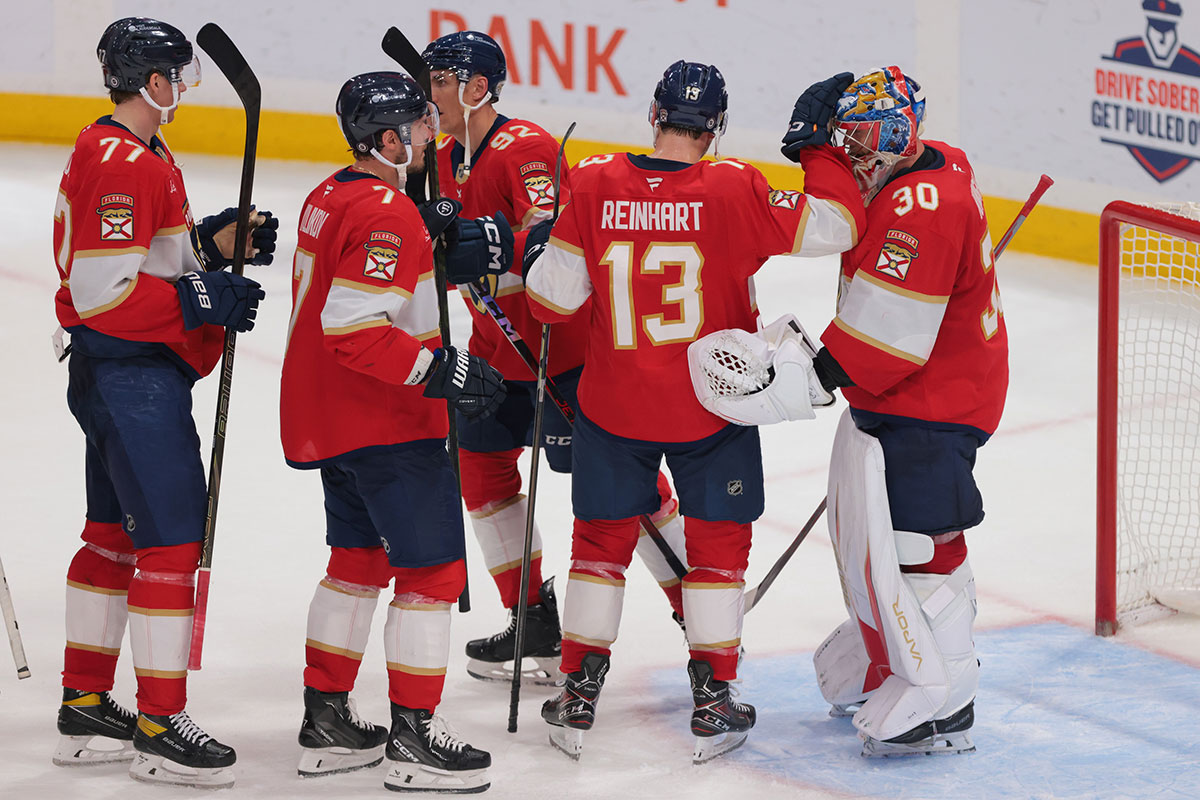 Florida Panthers Center Sam Reinhart (13) is celebrated with the Goldendender Spencer Knight (30) after the game against New York island in the Arena Amer.