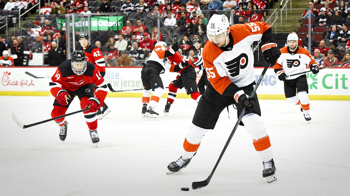 Philadelphia Flyers DefenseMan Rasmus Ristolainen (55) Skates with Paka against New Jersey Devils right wing Nathan Bastian (14) during the third period at the hospital center.