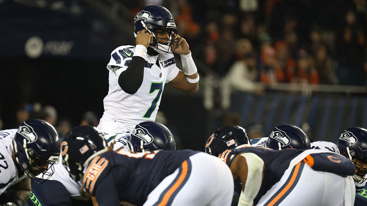 Dec 26, 2024; Chicago, Illinois, USA; Seattle Seahawks quarterback Geno Smith (7) signals a play during the first quarter against the Chicago Bears at Soldier Field.