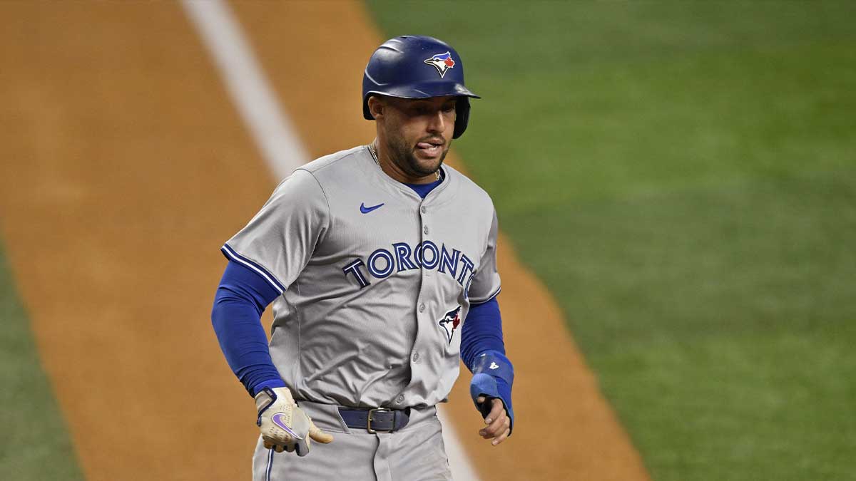 Toronto Blue Jays right fielder George Springer (4) scores a run against the Texas Rangers during the first inning at Globe Life Field.