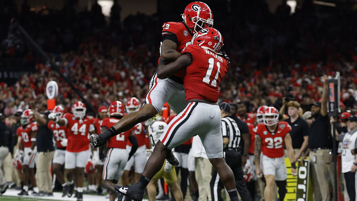 Georgia Bulldogs linebacker Jalon Walker (11) celebrates with Bulldogs defensive lineman Mykel Williams (13) after making a defensive stop against the Notre Dame Fighting Irish during the first quarter at Caesars Superdome.