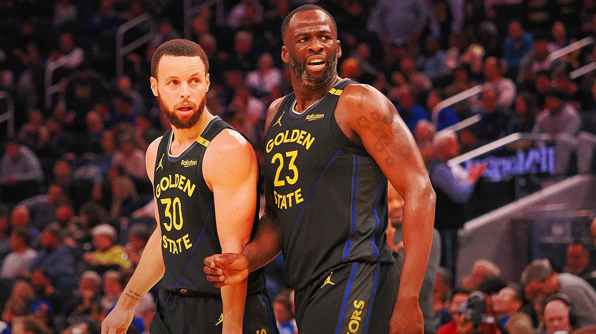 Gold state warriors preserve Stephen Curri (30) and forward Drayond green (23) according to Orlando Magic Player at half time in Chase Center.