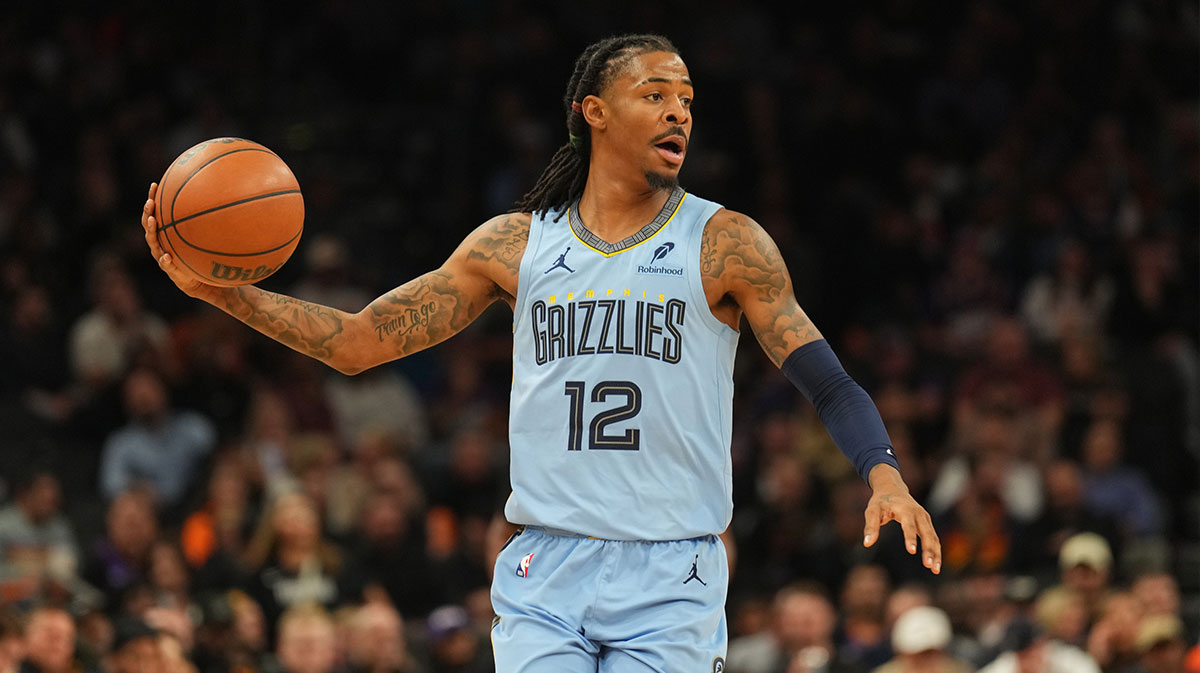 Grizzlies guard Ja Morant (12) controls the ball against the Phoenix Suns during the second half at Footprint Center