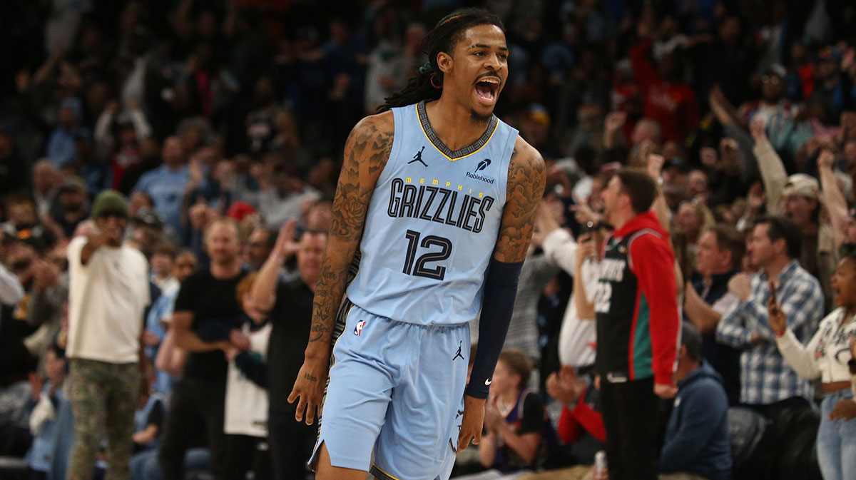 Grizzlies guard Ja Morant (12) reacts during over-time against the Phoenix Suns at FedExForum