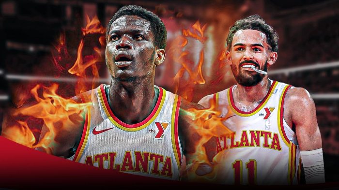 Trae Young and Mouhamed Gueye with a fire flame around Mouhamed's body.