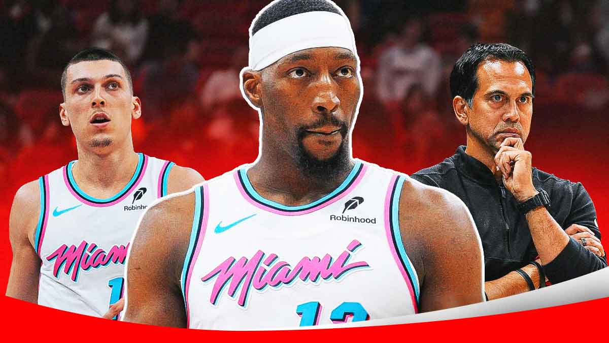 Miami Heat star Bam Adebayo in the middle with Tyler Herro and Erik Spoelstra on either side in front of Kaseya Center.