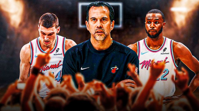 Miami Heat head coach Erik Spoelstra in the middle with Tyler Herro and Andrew Wiggins on either side in front of Kaseya Center.