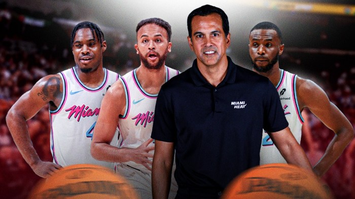 Miami Heat head coach Erik Spoelstra in the middle with Andrew Wiggins, Davion Mitchell, and Kyle Anderson on either side in front of Kaseya Center.