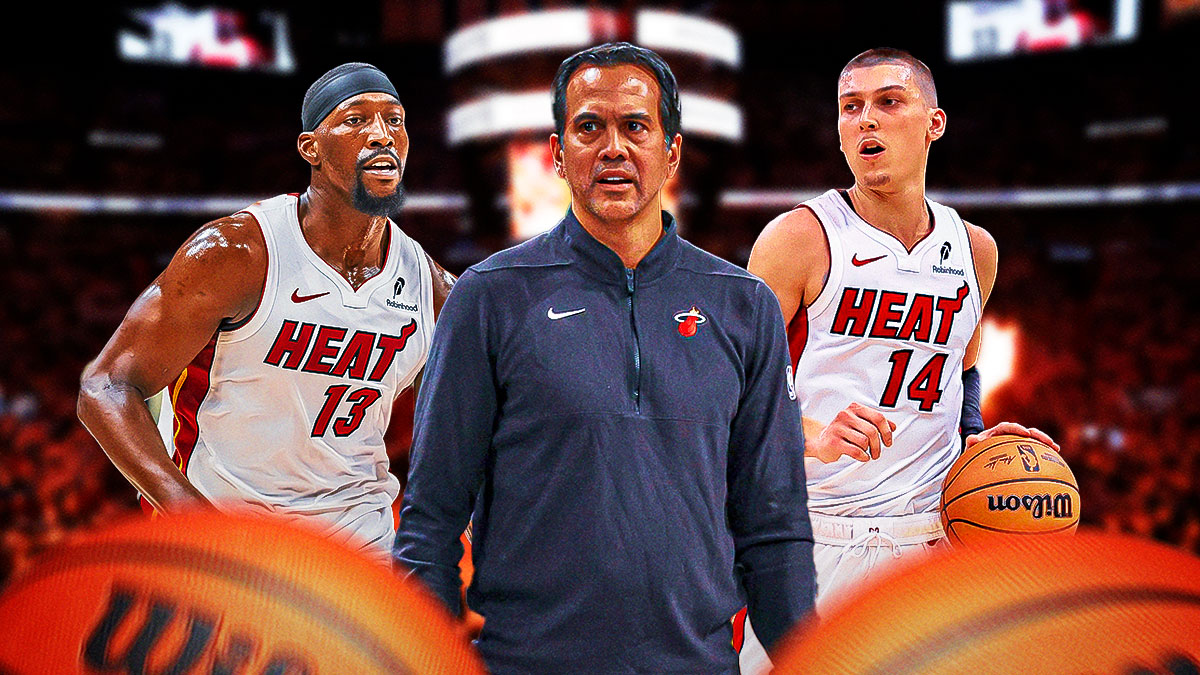 Miami Heat head coach Erik Spoelstra in the middle of Tyler Herro and Bam Adebayo in front of Kaseya Center.