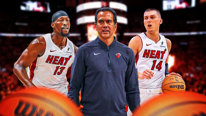 Miami Heat head coach Erik Spoelstra in the middle of Tyler Herro and Bam Adebayo in front of Kaseya Center.