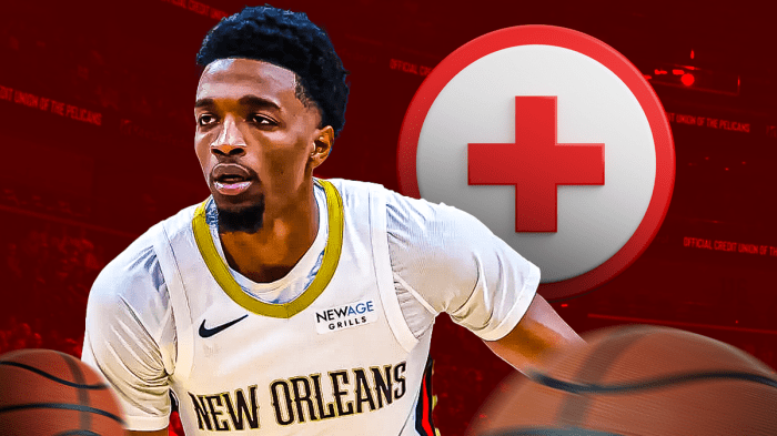 Pelicans' Herb Jones with medical Red Cross symbol