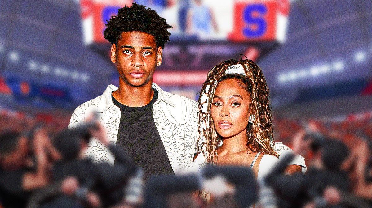 Kiyan and La La Anthony with Syracuse Orange basketball arena background.