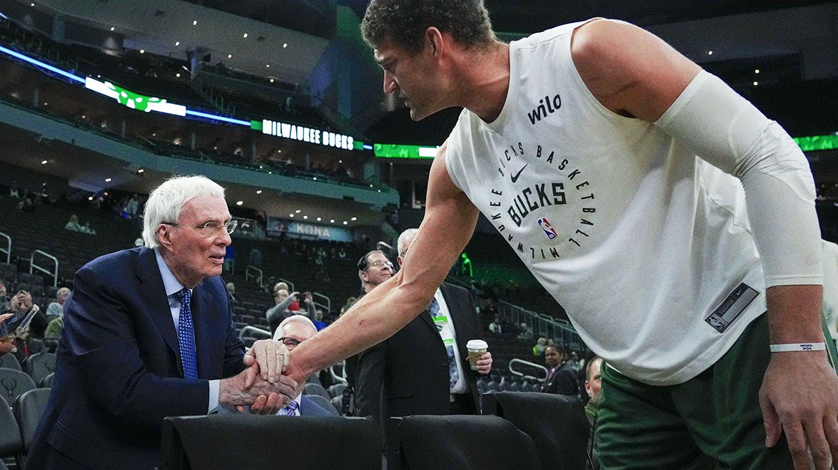 ESPN Roadcaster Hubie Brown Conversations with Milvaukee Bucks Center Brook Lopez (11) Before plays against Philadelphia 76ers on Fiserv Forum.