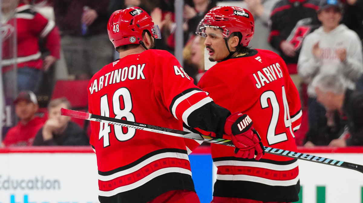 Carolina Hurricane Left wing Jordan Martinook (48) celebrates its empty net goal with Seth Jarvis Center (24) against Utah Hockey Club during the third period in the Lenovo Center.