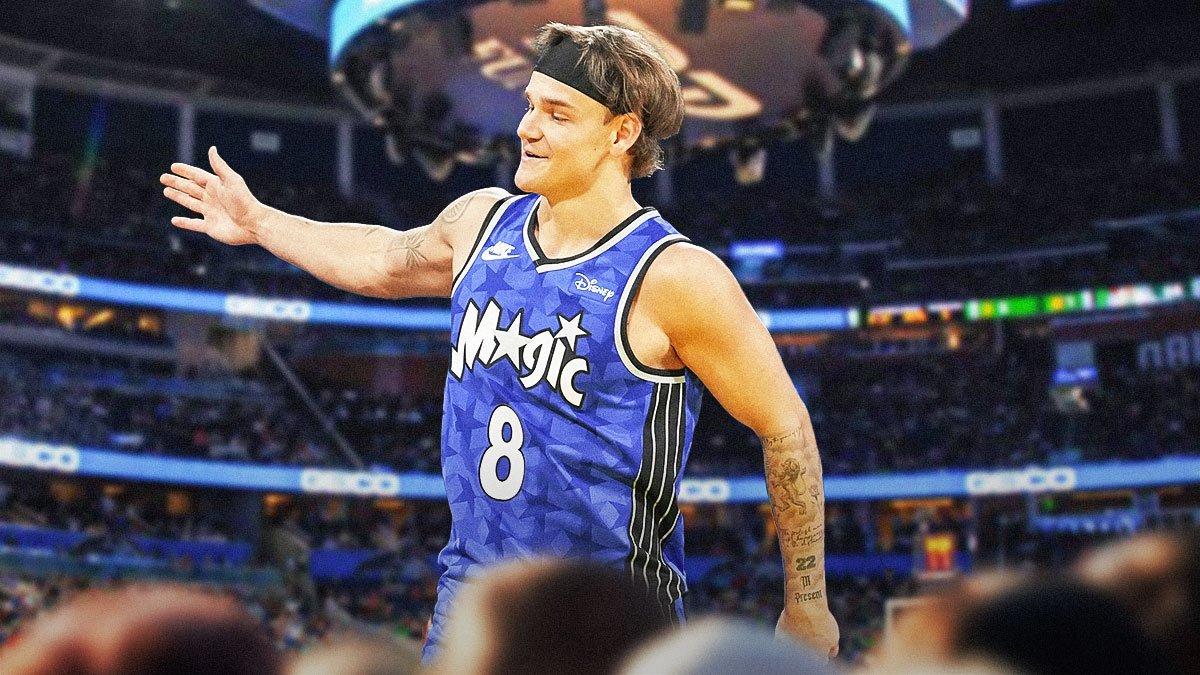 Orlando Magic player Mac McClung with the Orlando Magic arena in the background, G League layup