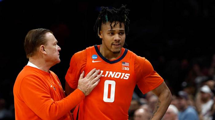 Illinois Fighting Illini head coach Brad Underwood reacts with guard Terrence Shannon Jr. (0) against the Connecticut Huskies in the finals of the East Regional of the 2024 NCAA Tournament at TD Garden.