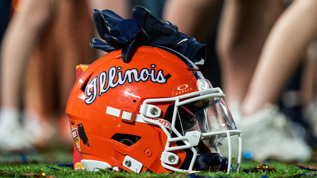 Dec 31, 2024; Orlando, FL, USA; A Illinois Fighting Illini helmet sitting on confetti after the game against the South Carolina Gamecocks at Camping World Stadium. Mandatory Credit: Jeremy Reper-Imagn Images