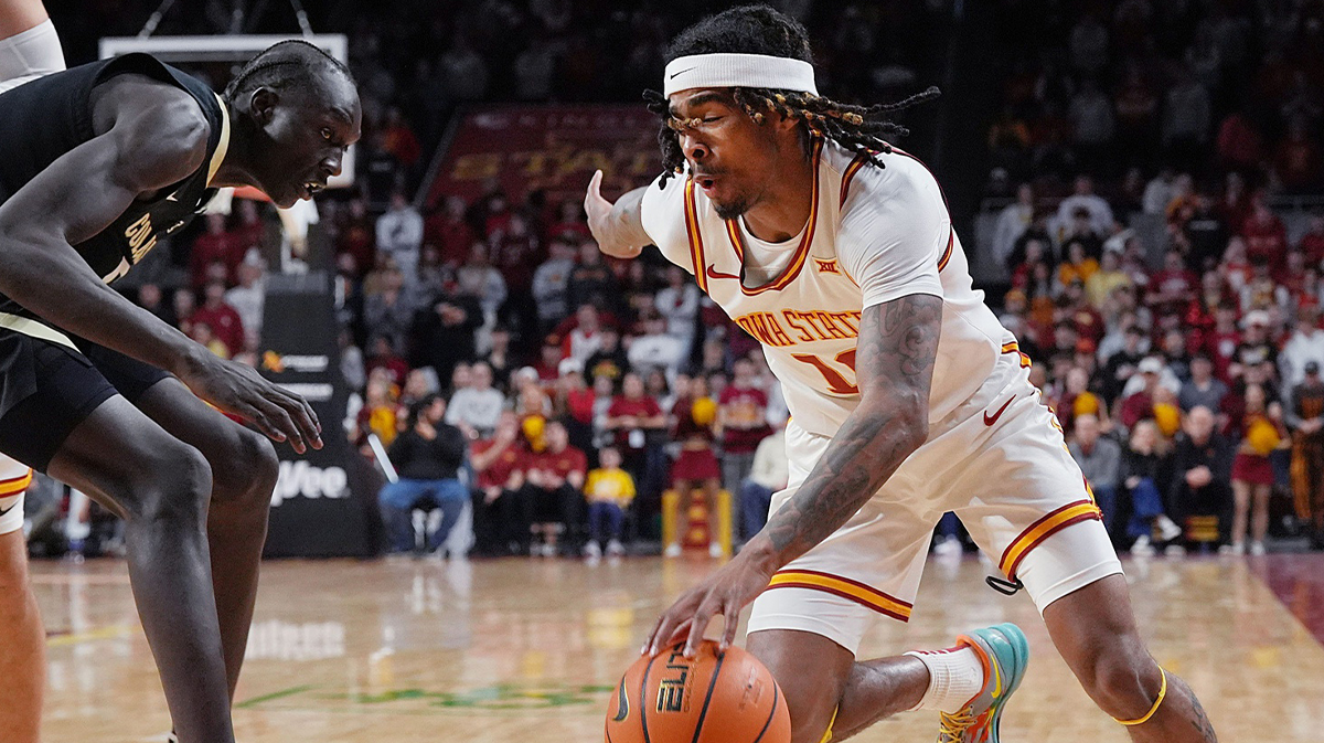 Iowa State Cyclones guard Keshon Gilbert (10) drives with the ball around Colorado Buffaloes forward Bangot Dak (8) during the first half in the Big-12 men’s basketball at Hilton Coliseum on Feb.18, 2025 in Ames, Iowa.