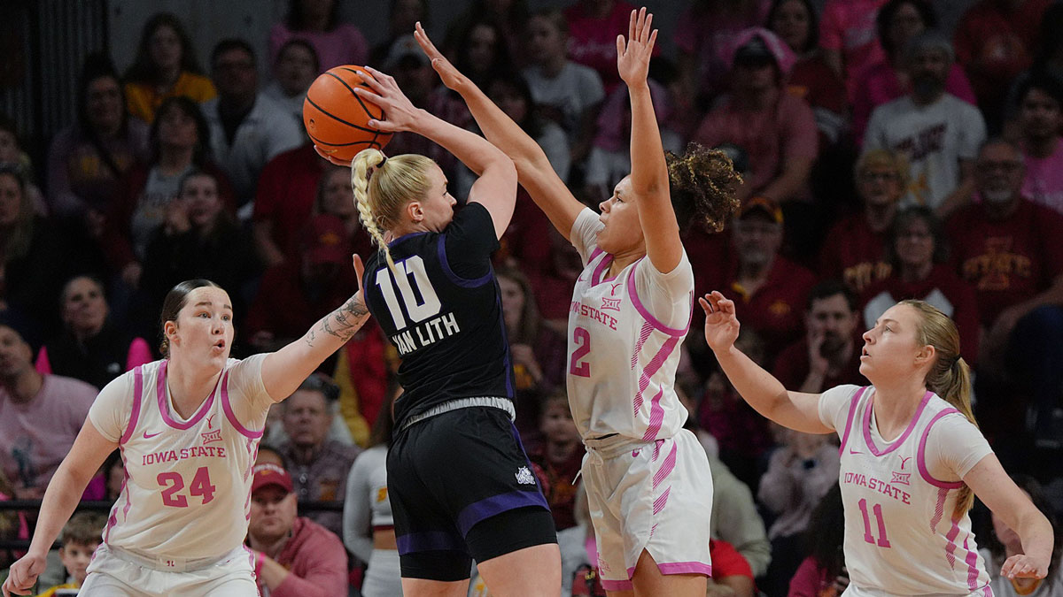 Iowa State women's basketball forward Addy Brown (24), guard Arianna Jackson (2) and guard Emily Ryan (11) defend as TCU women's basketball guard Hailey Van Lith (10) tries to shoot during the first quarter in the Big-12 women’s basketball showdown.