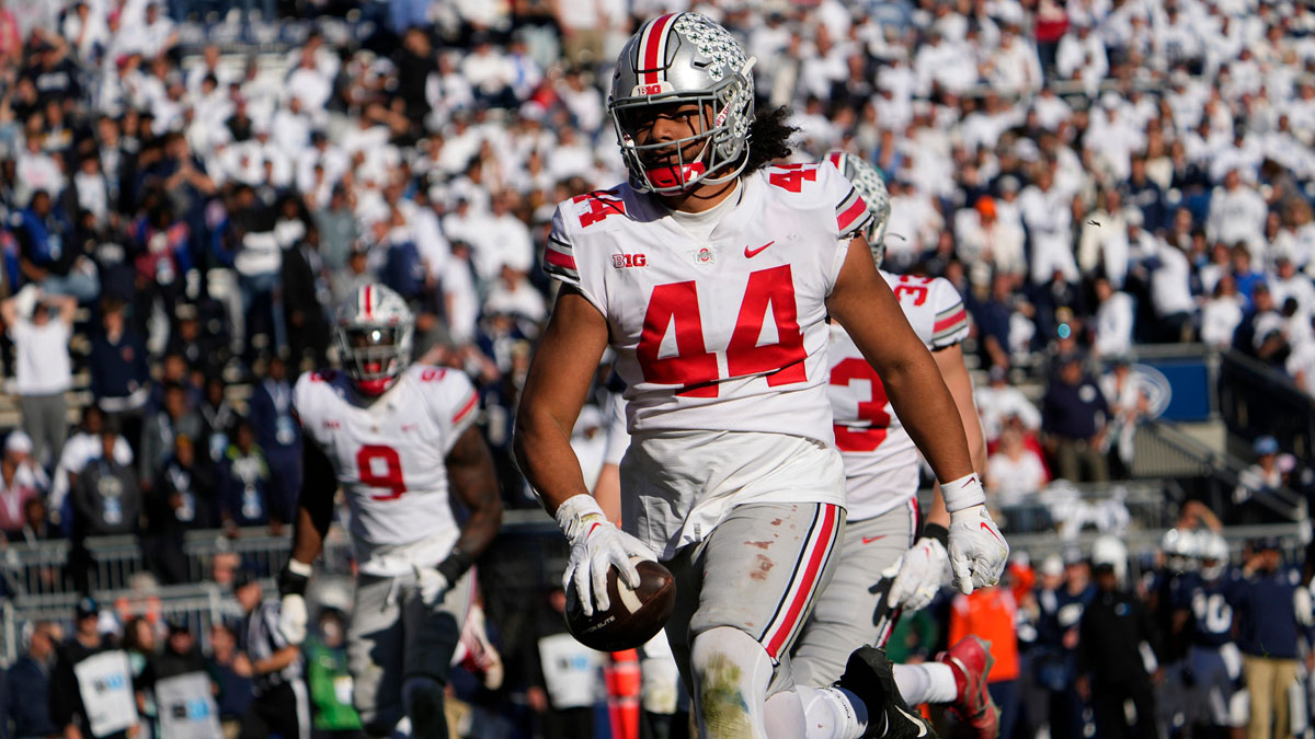 Ohio State Buckeyes defensive end J.T. Tuimoloau (44) runs for a touchdown after intercepting a pass by Penn State Nittany Lions quarterback Sean Clifford during the fourth quarter of the NCAA Division I football game at Beaver Stadium. Mandatory Credit: Adam Cairns-The Columbus Dispatch Ncaa Football Ohio State Buckeyes At Penn State Nittany Lions.