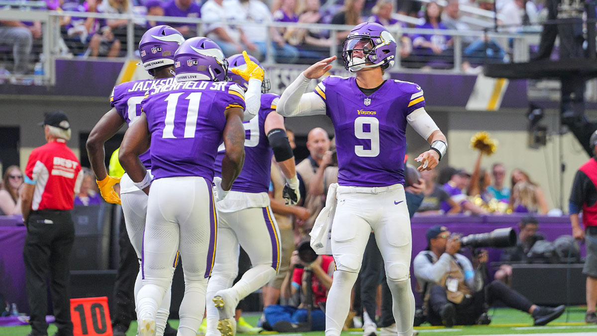 Minnesota Vikings quarterback J.J. McCarthy (9) celebrates wide receiver Trent Sherfield Sr. (11) touchdown against the Las Vegas Raiders in the third quarter at U.S. Bank Stadium.