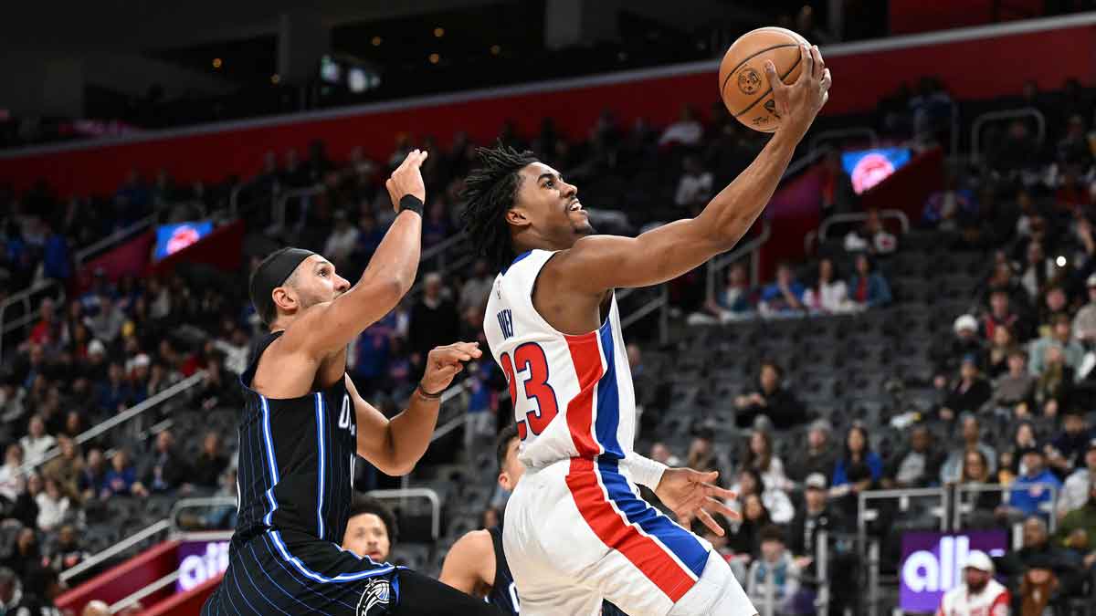 Detroit Pistons guard Jaden Ivey (23) drives past Orlando Magic guard Jalen Suggs (4) in the third quarter at Little Caesars Arena.