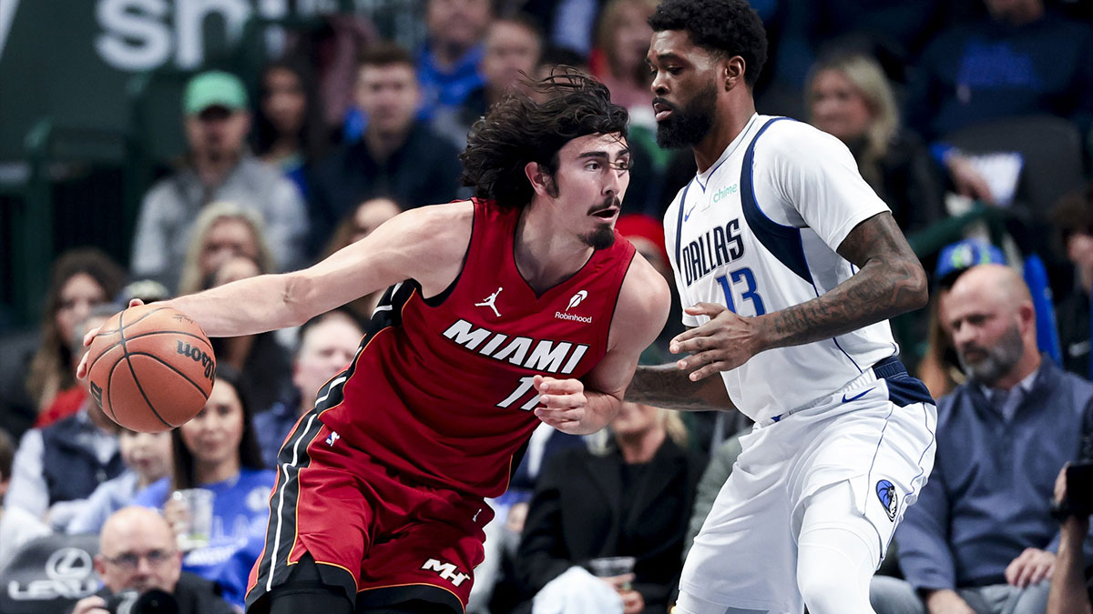 The goalkeeper of Miami Heat Jaime Jaquez Jr. (11) goes to the basket while the striker of Dallas Mavericks, Naji Marshall (13), defends during the first quarter of the American Airlines Center.