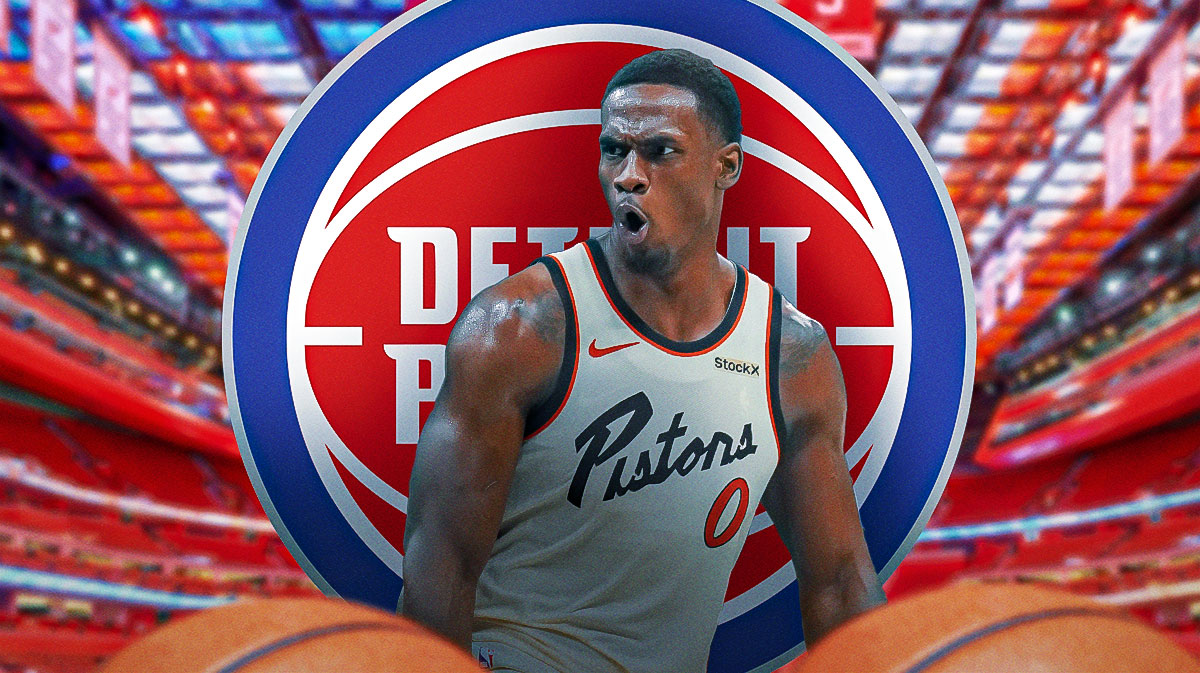 Jalen Duren shouting next to Pistons logo with Little Caesars Arena in background