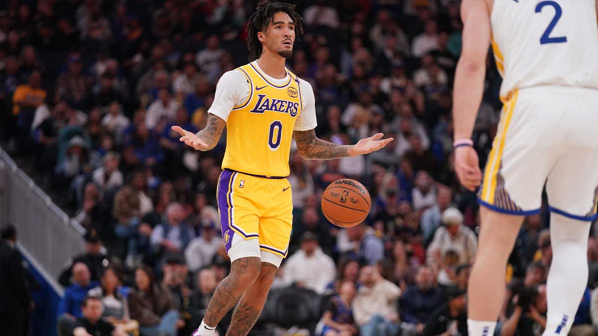 Los Angeles Lakers guard Jalen Hood-Schifino (0) dribbles the ball up the court against the Golden State Warriors in the first quarter at the Chase Center.