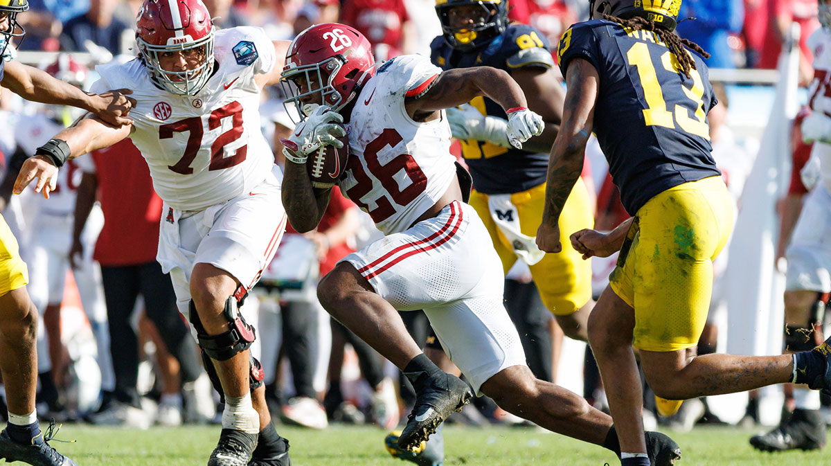 Alabama Crimson Tide running back Jam Miller (26) rushes with the ball against the Michigan Wolverines during the second half at Raymond James Stadium.
