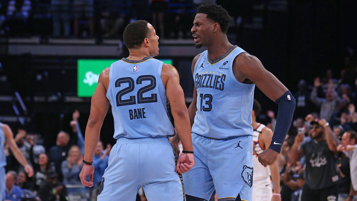 Memphis Grizzlies forward Jaren Jackson Jr. (13) reacts with Memphis Grizzlies guard Desmond Bane (22) during the third quarter against the Phoenix Suns at FedExForum.