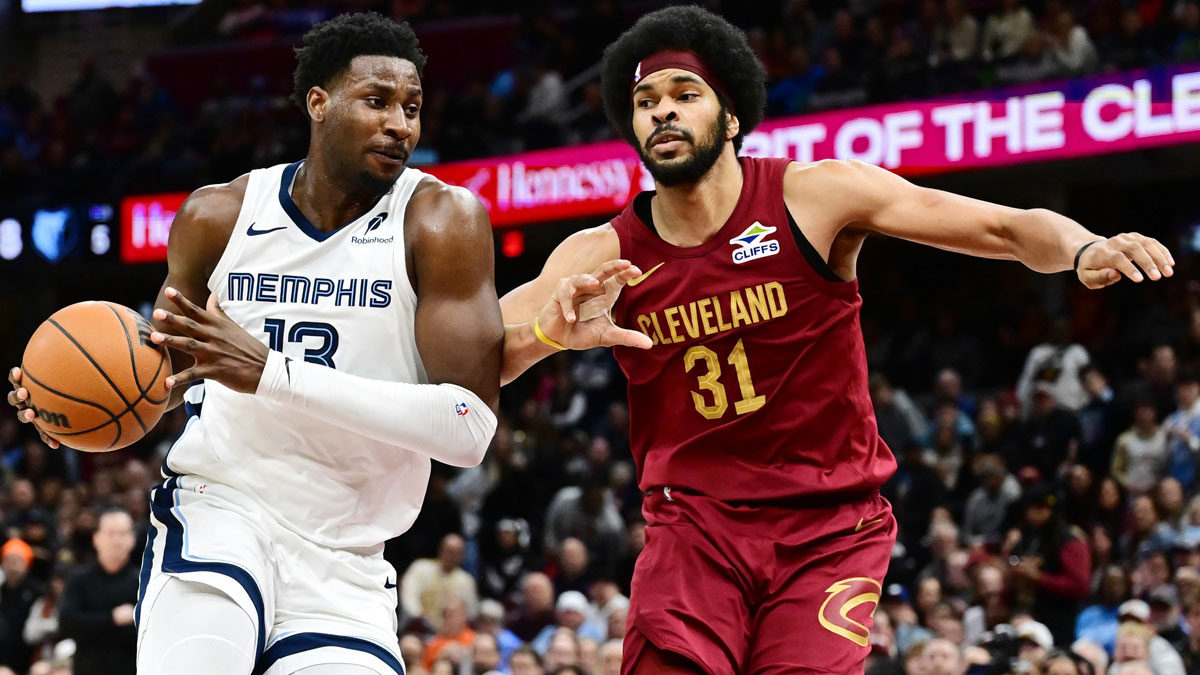 Memphis Grizzlies forward Jaren Jackson Jr. (13) drives to the basket against Cleveland Cavaliers center Jarrett Allen (31) during the second half at Rocket Arena.
