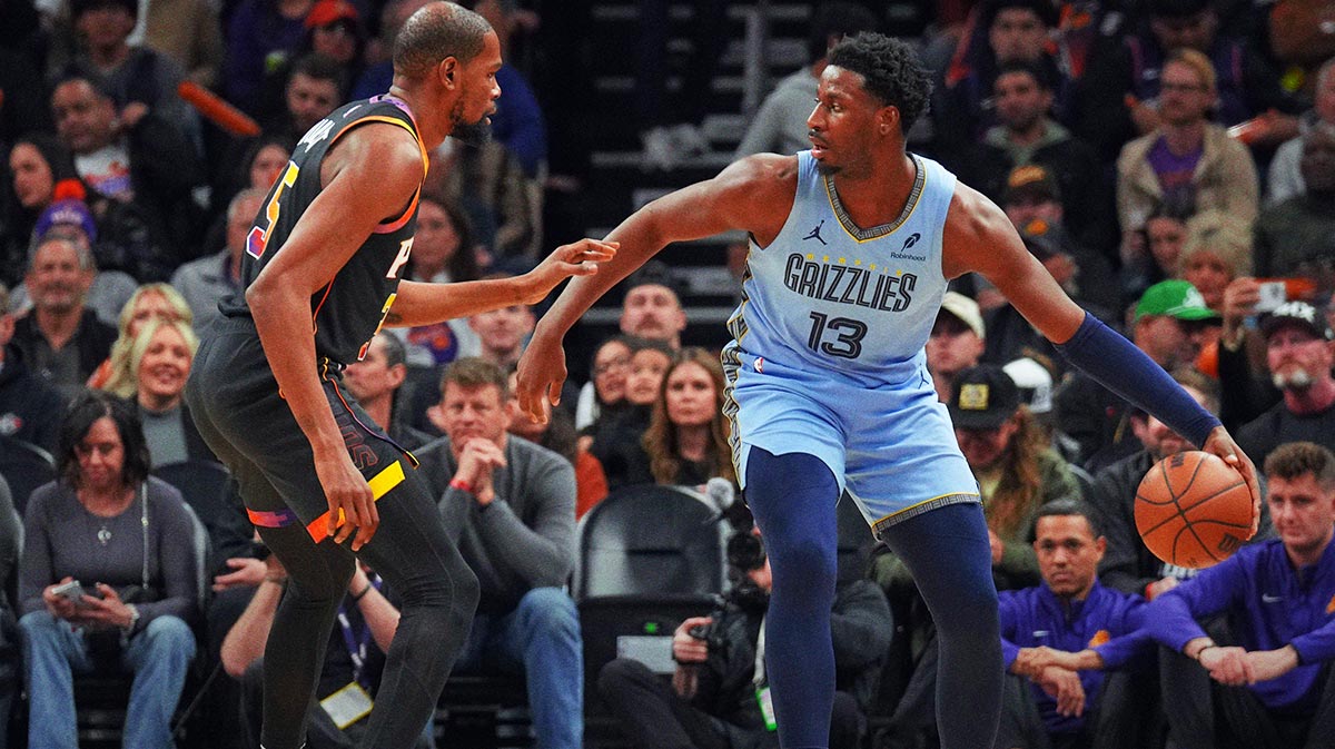 Phoenix Suns forward Kevin Durant (35) guards Memphis Grizzlies forward Jaren Jackson Jr. (13) during the first half at Footprint Center.