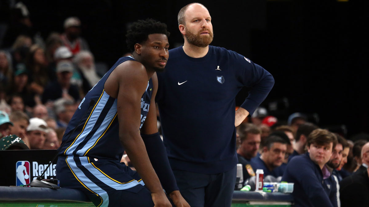 Memphis Grizzlies striker Jaren Jackson Jr. (13) and head coach Taylor Jenkins, consult during the third quarter against the San Antonio Spurs in Fedexforum. 