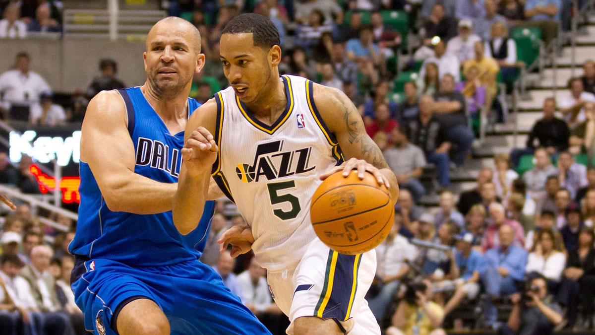 Utah Jazz point guard Devin Harris (5) dribbles while defended by Dallas Mavericks point guard Jason Kidd (2) during the second half at Energy Solutions Arena. The Jazz defeated the Mavericks 123-121 in triple overtime.