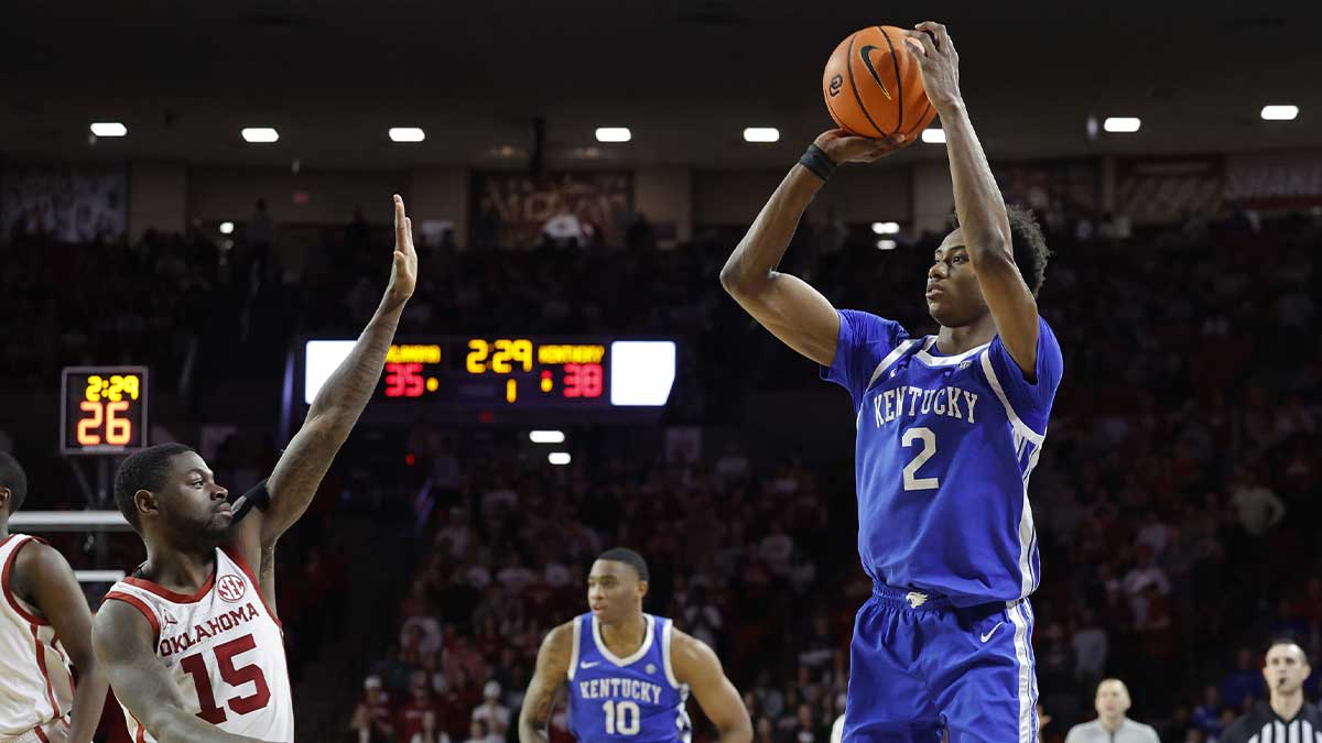 Kentucky Wildcats guard Jaxson Robinson (2) shoots a three point basket as Oklahoma Sooners guard Duke Miles (15) defend during the first half at Lloyd Noble Center.