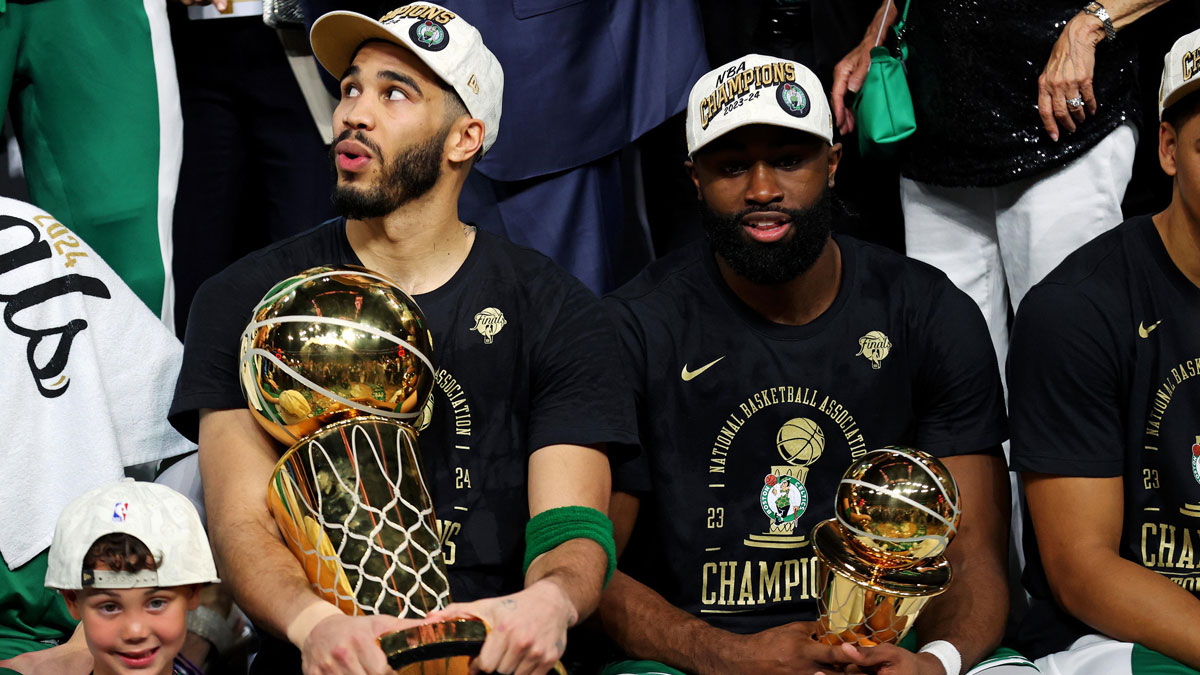 Boston Celtics Forward Jaison Tatum (0) and Jailen Brown (7) Celebrates with Larry O'Bryan Tropchi After the Dallas Mavericks in the game five of the NBA finals in the NBA to win the NBA Championship in the TD Garden. 