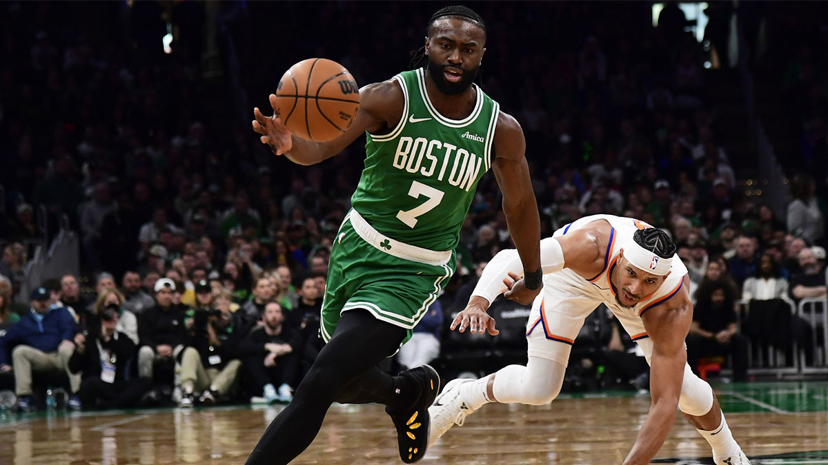 Boston Celtics guard Jaylen Brown (7) gains possession of the ball ahead of New York Knicks guard Josh Hart (3) during the second half at TD Garden.