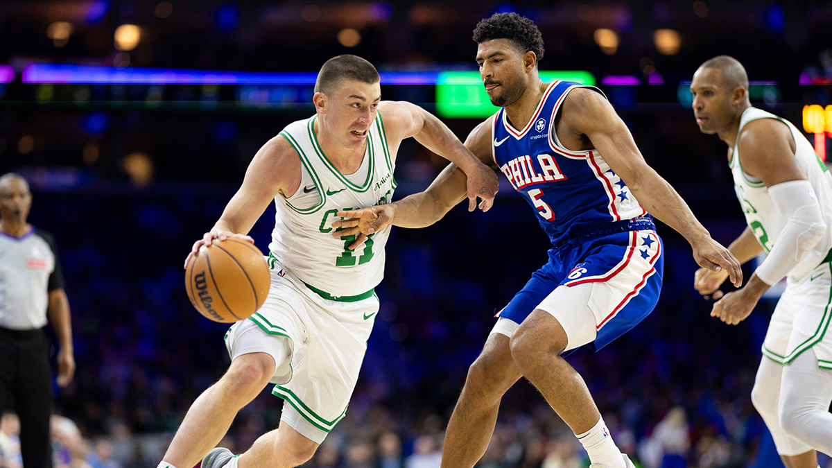 Boston Celtics Guard Payton Pritchard (11) Vehicles against Philadelphia 76ers Guard Kuentin Grimes (5) during the second quarter in Wells Fargo Center.